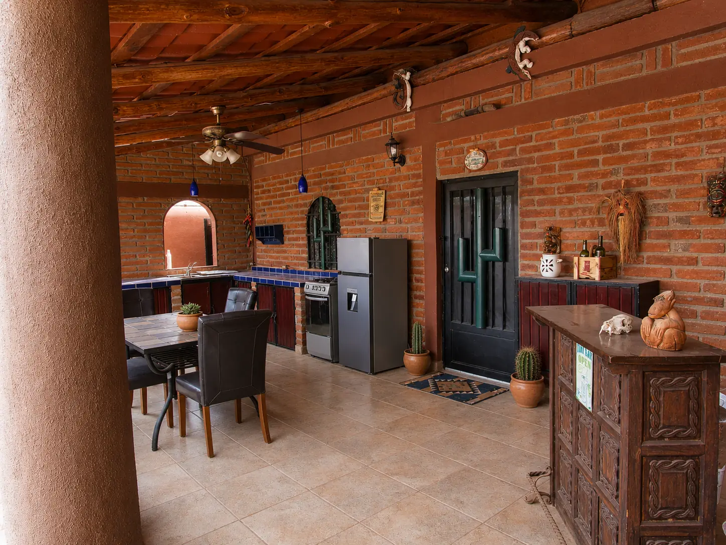 Covered outdoor kitchen and dining area