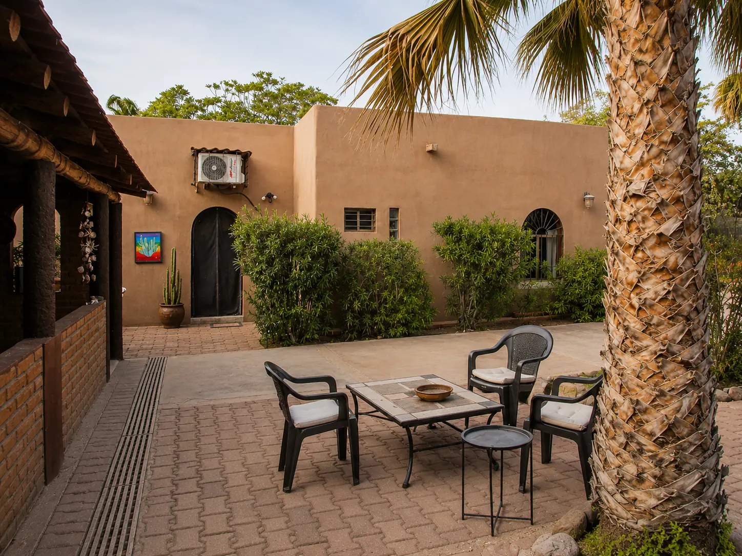 Sunlit courtyard facing the main house